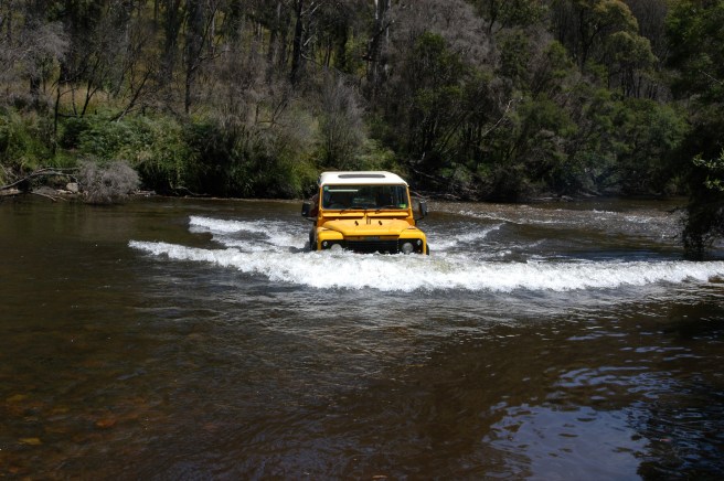 MY MATE IN THE 'YELLOW PERIL' HAVING SOME WADING PRACTISE.